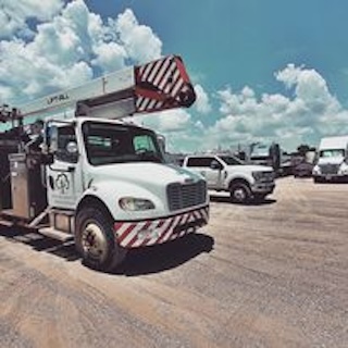 A large commercial utility truck with a crane.